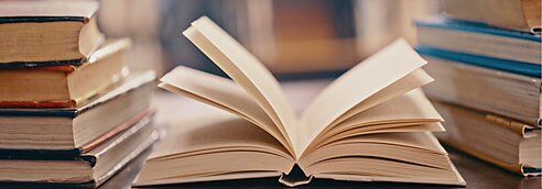 Open books on a library table